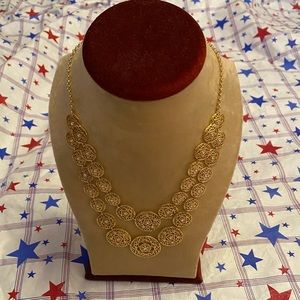 Gold tone geometric necklace with crystals